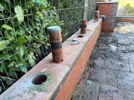 Metal Fencing on Top Atop Wall Bury